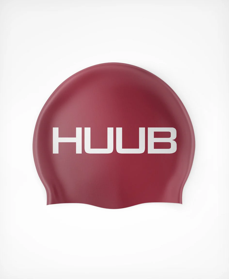 Bright orange HUUB silicone swim cap with a smooth, snug fit designed for comfortable swimming.